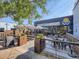 Outdoor seating area with picnic tables and string lights, creating a lively atmosphere for gatherings at 5703 Ammons St, Arvada, CO 80002