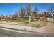 Park Place Olde Town entrance featuring a sign and well-maintained landscaping at 5703 Ammons St, Arvada, CO 80002