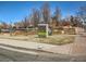 Street view featuring the Park Place sign in Olde Town with brick walkways and landscaping at 5703 Ammons St, Arvada, CO 80002