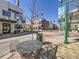 Street view with outdoor seating and local businesses, fostering a vibrant community atmosphere for dining and socializing at 5703 Ammons St, Arvada, CO 80002