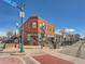 Street view of Al Davis Block at 1916, showcasing a red brick building with vintage architectural features at 5703 Ammons St, Arvada, CO 80002