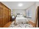 Cozy bedroom with plush carpeting, a large window, and ample closet space at 840 S Vance St # A, Lakewood, CO 80226