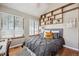 Bright bedroom with hardwood floors, large windows, and a vaulted ceiling at 840 S Vance St # A, Lakewood, CO 80226