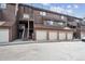 Exterior view of multi-story building with multiple garages, balconies, and outdoor staircases at 840 S Vance St # A, Lakewood, CO 80226