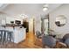 Eat-in kitchen features a breakfast bar, stainless appliances, and adjoining dining area at 840 S Vance St # A, Lakewood, CO 80226