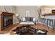Cozy living room with a charming fireplace, stylish decor, and hardwood floors at 840 S Vance St # A, Lakewood, CO 80226