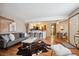 Inviting living room with hardwood floors, modern furnishings, and an open floor plan to the kitchen at 840 S Vance St # A, Lakewood, CO 80226