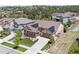 Expansive aerial shot of a home with solar panels, a landscaped yard, and a private fenced-in area at 8142 S Langdale Way, Aurora, CO 80016