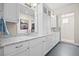 Bright bathroom features white cabinets, granite countertops and stylish lighting at 8142 S Langdale Way, Aurora, CO 80016