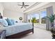Spacious bedroom with large windows offering lots of natural light and tree view at 8142 S Langdale Way, Aurora, CO 80016