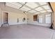 Spacious two-car garage with epoxy flooring, Tesla charger, and ample storage space at 8142 S Langdale Way, Aurora, CO 80016