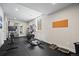 Well-equipped home gym with modern exercise equipment and ample space for workouts at 8142 S Langdale Way, Aurora, CO 80016