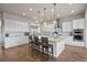 Spacious kitchen with white cabinetry, granite countertops, and stainless steel appliances at 8142 S Langdale Way, Aurora, CO 80016