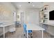 Bright office space features white walls, modern furniture, and shelving for efficient organization at 8142 S Langdale Way, Aurora, CO 80016