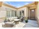 Cozy outdoor patio with comfortable seating, ideal for relaxing or entertaining guests at 8142 S Langdale Way, Aurora, CO 80016