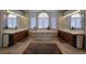 Bathroom showcasing a bathtub, and vanities, and a light, neutral color scheme at 5799 Crestbrook Cir, Morrison, CO 80465