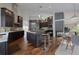 Modern kitchen with dark wood cabinets, a center island, and a breakfast nook at 5799 Crestbrook Cir, Morrison, CO 80465