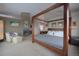 Comfortable main bedroom featuring a fireplace and a four-poster bed at 5799 Crestbrook Cir, Morrison, CO 80465