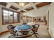 Basement featuring a game table, pool table and stone wet bar at 1423 E Fair Pl, Centennial, CO 80121