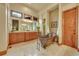 Bathroom featuring a clawfoot tub, marble countertops, and a large mirror at 1423 E Fair Pl, Centennial, CO 80121