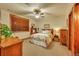 Comfortable bedroom with warm natural light, carpeted floors and wood trim at 1423 E Fair Pl, Centennial, CO 80121