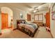 Bedroom with ample natural light, a sitting area, and an en-suite bathroom at 1423 E Fair Pl, Centennial, CO 80121
