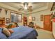Bedroom with desk, guitar, natural light, and decorative touches at 1423 E Fair Pl, Centennial, CO 80121