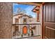 View of a charming home's front entrance from a balcony, featuring stone accents and an inviting front door at 1423 E Fair Pl, Centennial, CO 80121