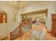 Open foyer featuring hardwood floors, a staircase and a view to the open floorplan living and dining areas at 1423 E Fair Pl, Centennial, CO 80121