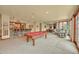 Spacious game room with a billiards table and a bar area for entertaining at 1423 E Fair Pl, Centennial, CO 80121