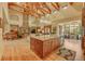 Open-concept kitchen with a large island, granite countertops, and stainless steel appliances at 1423 E Fair Pl, Centennial, CO 80121