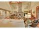Spacious living room with stone fireplace, vaulted ceiling, and comfortable seating area at 1423 E Fair Pl, Centennial, CO 80121