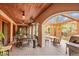 Covered patio with ceiling fans, heaters, and an outdoor dining area, perfect for entertaining at 1423 E Fair Pl, Centennial, CO 80121