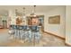 Custom wine cellar with stone accents, bar seating, and ample wine storage at 1423 E Fair Pl, Centennial, CO 80121