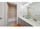 Bathroom featuring double sinks and a tub shower at 1780 N Washington St # 203, Denver, CO 80203