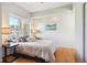 Bright bedroom features hardwood floors, recessed lighting, and a large window for ample natural light at 1780 N Washington St # 203, Denver, CO 80203