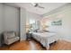 Bright bedroom features hardwood floors, recessed lighting, and a large window for ample natural light at 1780 N Washington St # 203, Denver, CO 80203