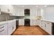 A stunning kitchen with modern appliances and hardwood floors at 1780 N Washington St # 203, Denver, CO 80203
