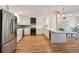 An open concept kitchen with stainless steel fridge and dark appliances at 1780 N Washington St # 203, Denver, CO 80203