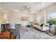 An open-concept living room featuring a modern ceiling fan and track lighting at 1780 N Washington St # 203, Denver, CO 80203