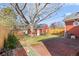 Spacious backyard featuring a brick patio and a large storage shed at 1273 S Jackson St, Denver, CO 80210