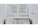 Elegant bathroom with a dual-sink vanity and framed mirrors above the sinks at 1273 S Jackson St, Denver, CO 80210