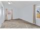 Spacious bedroom with soft carpet, bright natural light, and a clean, minimalist style at 1273 S Jackson St, Denver, CO 80210