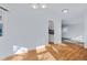 Open dining area with hardwood floors that leads to an updated kitchen and living spaces at 1273 S Jackson St, Denver, CO 80210
