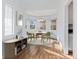 Charming dining area featuring a bay window, hardwood floors, and a modern chandelier at 1273 S Jackson St, Denver, CO 80210