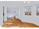 Inviting dining area featuring hardwood floors, bright lighting, and outdoor views at 1273 S Jackson St, Denver, CO 80210