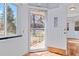 Front door of home with view of landscaped yard and porch at 1273 S Jackson St, Denver, CO 80210