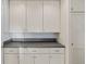 Bright kitchen features white cabinets, gray countertop, and a functional design at 1273 S Jackson St, Denver, CO 80210