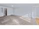 Bright living room with neutral carpet and an arched doorway at 1273 S Jackson St, Denver, CO 80210