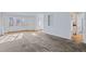 Spacious living room with neutral carpet and view to entry at 1273 S Jackson St, Denver, CO 80210